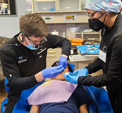 Dr. Beelman and team providing dental care